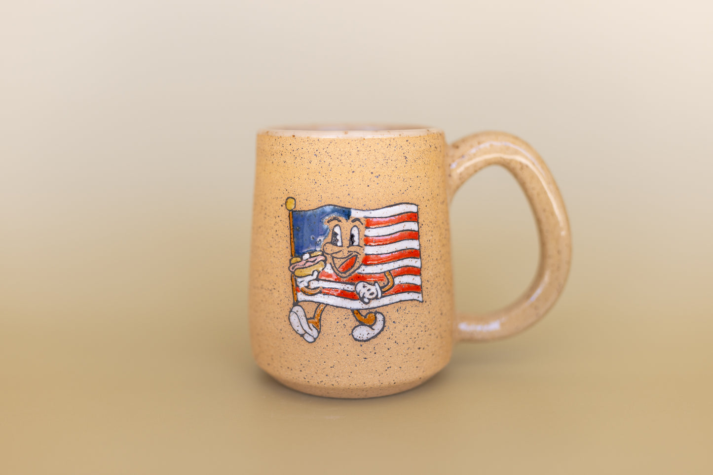 MUG 30/75 FLAG EATING HOT DOG